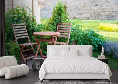 empty wood table and chairs on the terrace at summer day Wall mural