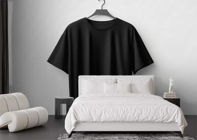 Fashionable oversized black T-shirt on a white background. Mockup presentation and advertising of the brand, merch and clothing stores. Showroom sale and quality products Wall mural