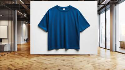 Fashionable oversized blue T-shirt on a white background. Mockup presentation and advertising of the brand, merch and clothing stores. Showroom sale and quality products Wall mural