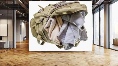 the backpack of color khaki, lies opened and in it two warm swea Wall mural