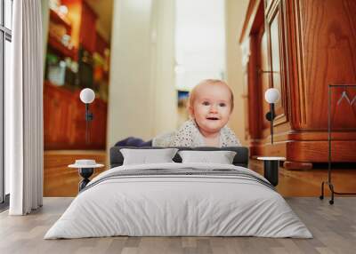 Baby girl learning to crawl Wall mural