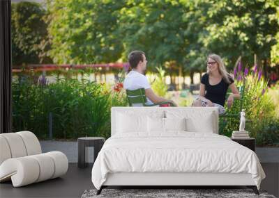 Couple relaxing in the Tuileries garden of Paris Wall mural