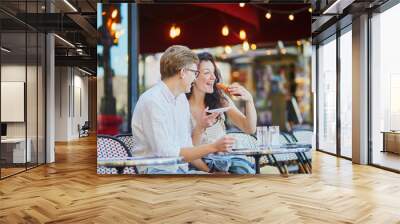 Happy romantic couple in Paris, drinking coffee Wall mural