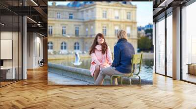 Happy young couple having a date in Paris Wall mural