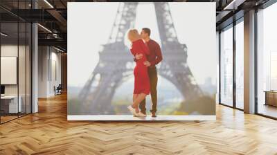 Romantic couple in love near the Eiffel tower Wall mural