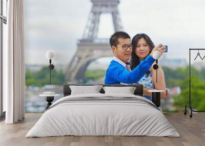 Young romantic Asian couple in Paris Wall mural