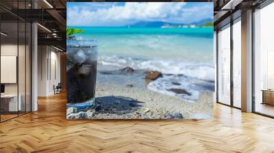 Refreshing cocktail, Rum and Coke by the ocean. Concept template for advertising travel agencies, vacation and summer cafes and refreshments with space for text Wall mural