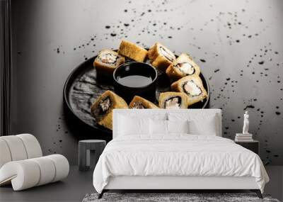 rolls on a black background Wall mural