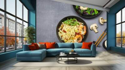 Stir fry noodles with vegetables and shrimps in bowl. Top view. Copy space. Wall mural