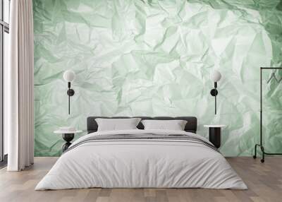 Texture of crumpled greenish paper, background. Photo with vignette. Wall mural