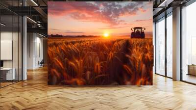 Tractor in wheat field at sunset during harvest season. Agriculture and farming concept. Design for agricultural machinery advertisement, harvest time promotion. Wide landscape shot with vibrant sky Wall mural