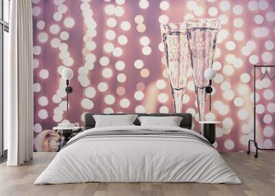 two glasses of champagne with christmas toys. festive lights bok Wall mural