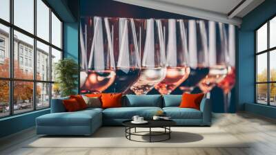 Wine glasses in a row. Buffet table celebration of wine tasting. Nightlife, celebration and entertainment concept Wall mural