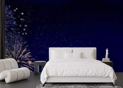 Fireworks, colorful sylvester-fireworks on blue background with sparks and space for text Wall mural