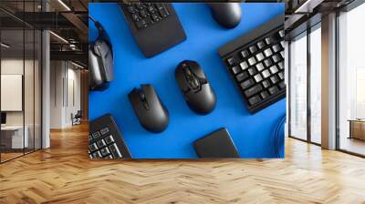 top view a gaming gear, mouse, keyboard, headset, headphone on table background. Wall mural