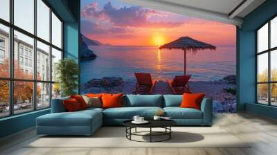 A romantic beach sunset, two deserted sun loungers under a rustic umbrella, the horizon lit up with the last appearance of the sun of the day Wall mural