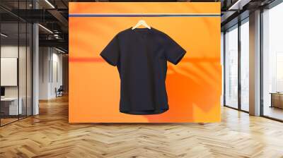 black t-shirt on orange background with tropic plants shadows. 3d rendering Wall mural