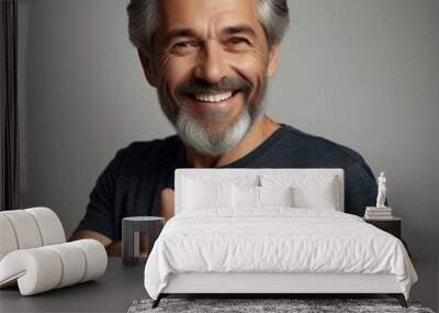 Smiling mature man wearing t-shirt isolated on white background. Portrait. Happy middle aged older guy, confident mid adult handsome bearded gray-haired male model in his 40s looking at camera. He poi Wall mural