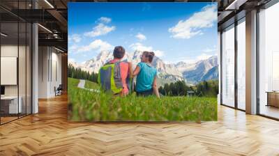 Travelers hiking in breathtaking landscape of Dolomites Mounatins in summer in ALta Badia, Italy. Wall mural