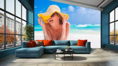 woman in bikini and straw hat having fun on tropical beach Wall mural