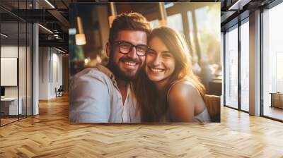 Cheerful couple with menu in a restaurant Wall mural