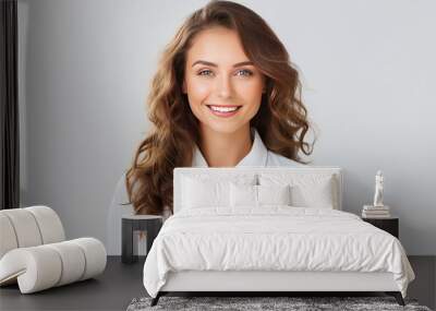 Close-up portrait of beautiful young businesswoman looking happy and confident to the left. Big smile on her face, looking beautiful and cheerful standing isolated on white background Wall mural