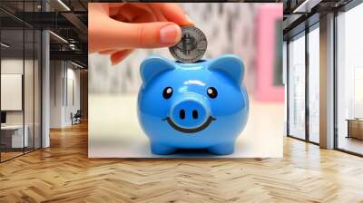 Illustration of a hand placing a coin into a piggy bank Wall mural