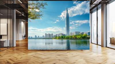 Stunning vista of downtown Seoul featuring a modern skyscraper by the lake against a clear blue sky. Seoul, a prominent tourist destination in Asia. Wall mural