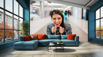 Excited shoppingholic woman in shopping mall.Buying in designer store.Wardrobe sale shopping.Hoby buyer.Weakness for clothes.Clothing shopping after reopening stores.New apparel retail store opened. Wall mural