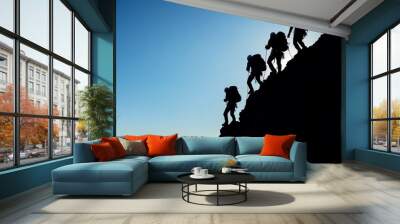 Silhouetted Climbers on Mountain Ridge Wall mural