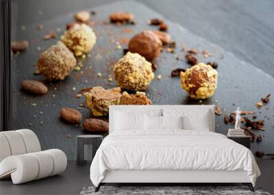 Handmade chocolates sprinkled with pistachio crumbs  Wall mural