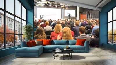 people sitting rear at the business conference Wall mural