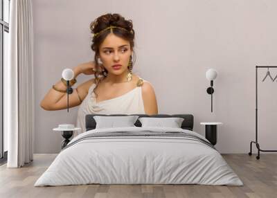 portrait of beautiful young greek woman in antique white toga, looking side, with copy space Wall mural