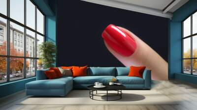 Red Finger nail point isolated black background Wall mural