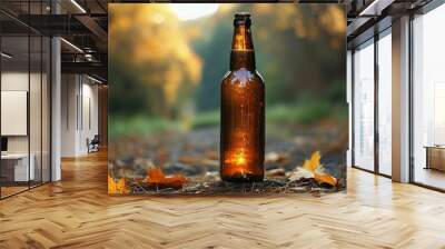 a bottle of beer sits on the ground in the forest. Wall mural