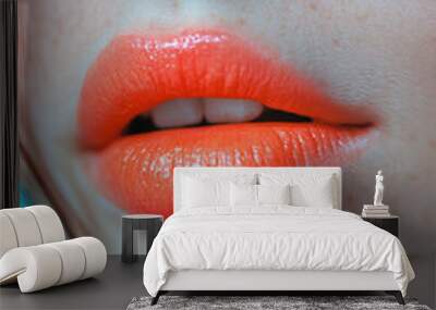 A woman with orange lipstick and blue eyes Wall mural