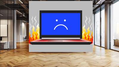 Open laptop with unhappy face icon on screen and flame Wall mural