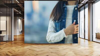 A close-up of a young woman smiling proudly, celebrating Independence Day. Her hand is on her chest, embodying patriotism and the festive spirit of summer. Wall mural