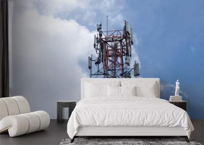 Close view of communication cell phone tower shot against blue sky. Technology, broadcast, telecommunication, data transmission and outage concept. Wall mural