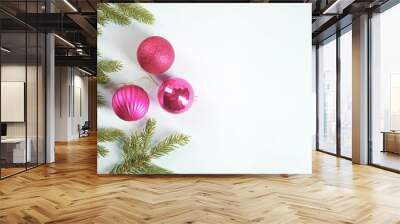 Christmas decor of Christmas balls and fir branches. White background. View from above. Free space under the text. Wall mural