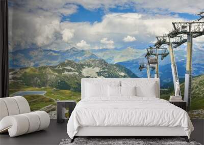 Alpine view and cable car near Arcs 2000 ski station in Savoie, France. Mountain summer resort vacation background. Healthy lifestyle, active family holidays concept.  Wall mural