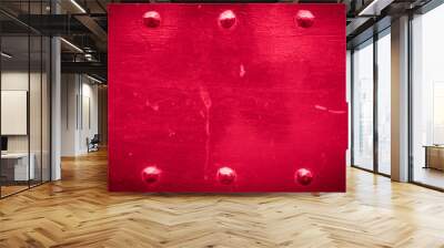 Red old metal background with rivets. Vintage abstract texture with shading borders. Wall mural