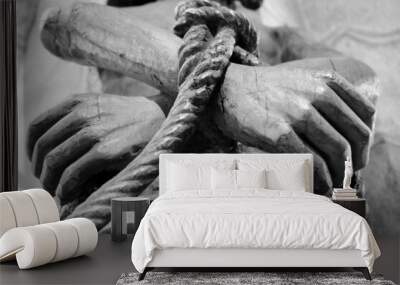 Wooden statue of Jesus with tied hands. Black white photo. Wall mural