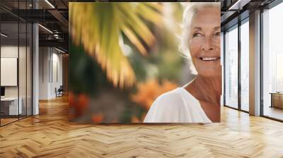 Elegant and happy mature woman with gray hair traveling on tropical vacation Wall mural