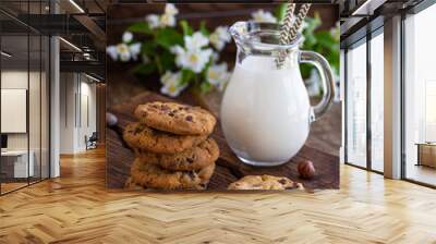 Chocolate chip cookies with milk on  wooden table Wall mural