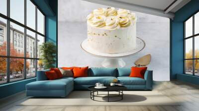 White cake on cake stand on the white background Wall mural