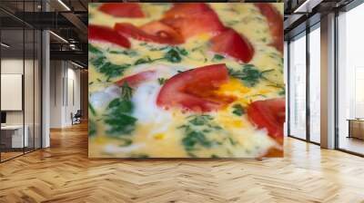 Fried eggs with tomatoes for a quick breakfast close-up Wall mural