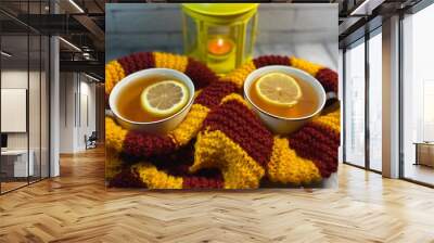 Two cups of tea cozy autumn photo with scarf, candle and light  Wall mural