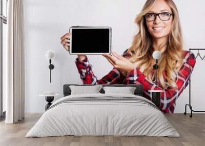 Smiling woman with tablet computer Wall mural