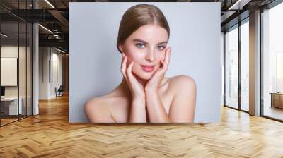 Beautiful Young Woman with Clean Fresh Skin .Girl beauty face care. Facial treatment . Cosmetology , beauty and spa . Wall mural